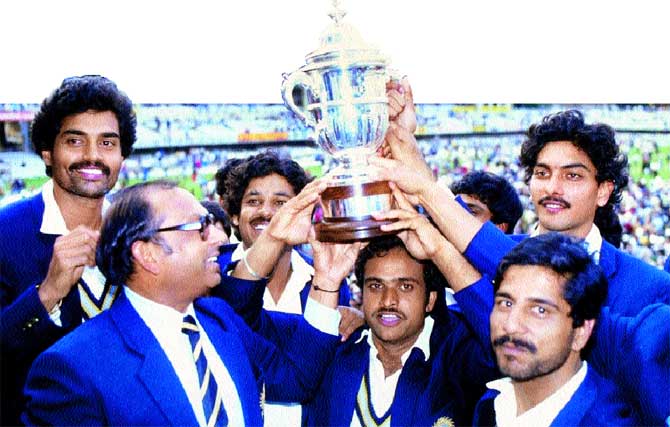 The Indian team holds the Prudential World Cup after beating West Indies. Dilip Vengsarkar is at the extreme left behind manager PR Man Singh.