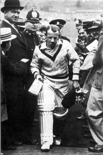 Australian cricketer Sir Donald Bradman walking through crowds after hitting a triple century in Leeds in 1938. Pic/AFP