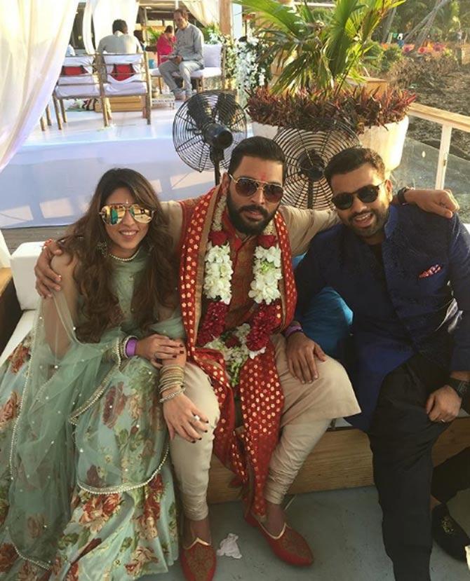 In picture: Rohit Sharma and Ritika Sajdeh with Yuvraj Singh on his wedding day
