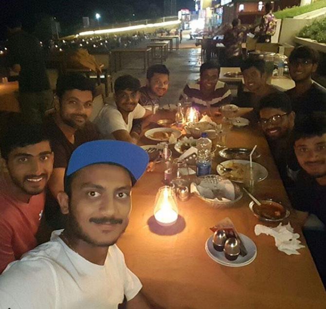 RP Singh with Axar Patel and some friends at a dinner