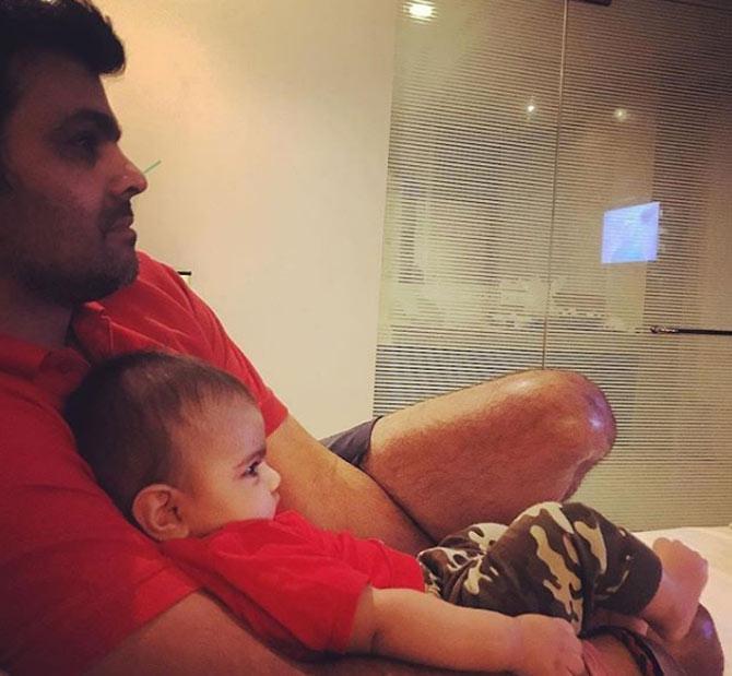 RP Singh watches TV with his daughter