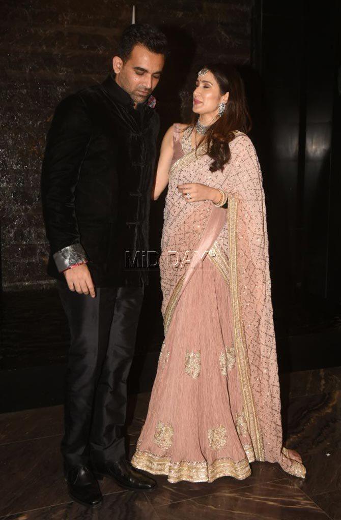 Zaheer Khan looked dapper in a black suit and Sagarika Ghatge beautiful in her beige saree Zaheer Khan looked dapper in a black suit and Sagarika Ghatge beautiful in her beige saree