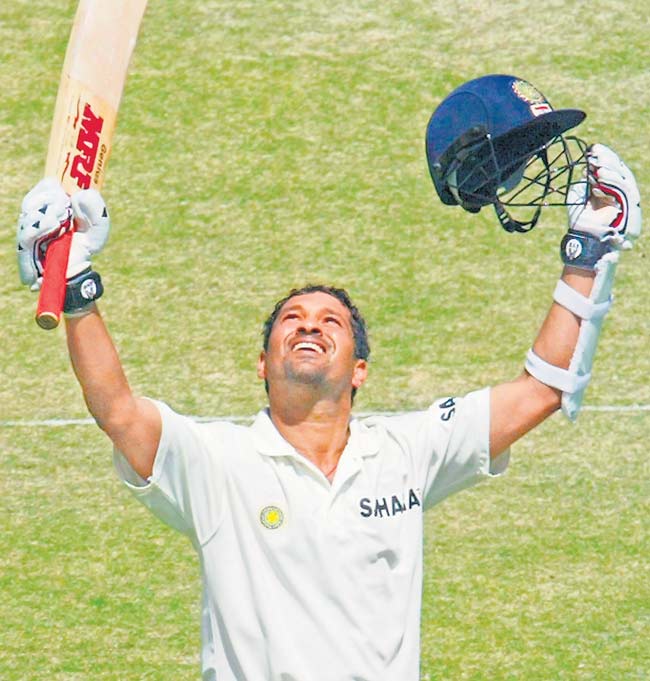 March 29, 2004: Sachin Tendulkar celebrates after reaching his century during day 2 of the 1st Test Match between Pakistan and India at Multan Stadium in Multan, Pakistan. (Photo by Scott Barbour/Getty Images)