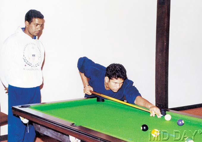 Right on cue: Trying his hand at snooker. Pic/MiD DAY Archives