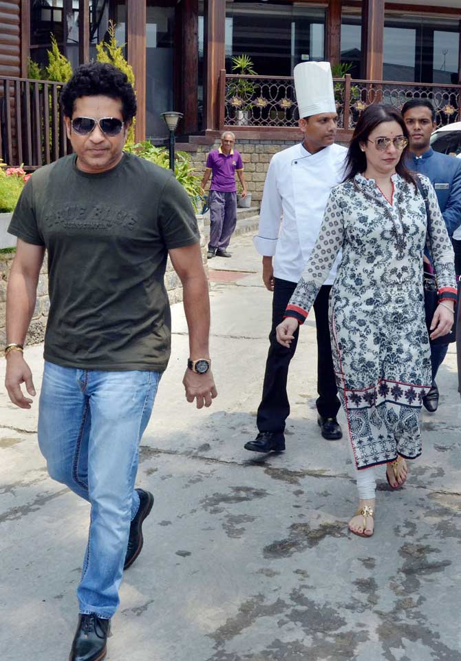 Sachin Tendulkar with his wife Anjali Tendulkar at Dharamsala. Earlier in an interview, Sachin Tendulkar said the time spent with family plays an integral part in everyone's life. 'Home is where most of our precious moments are made. Whether it is festival, dinners, or small family occasions, memories with families play an integral part in our lives,' said Tendulkar, who recently featured in a new commercial for a power firm. (Pics/ PTI)