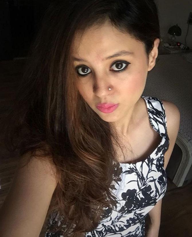 In picture: Sakshi Dhoni clicks a selfie in a black and white dress.