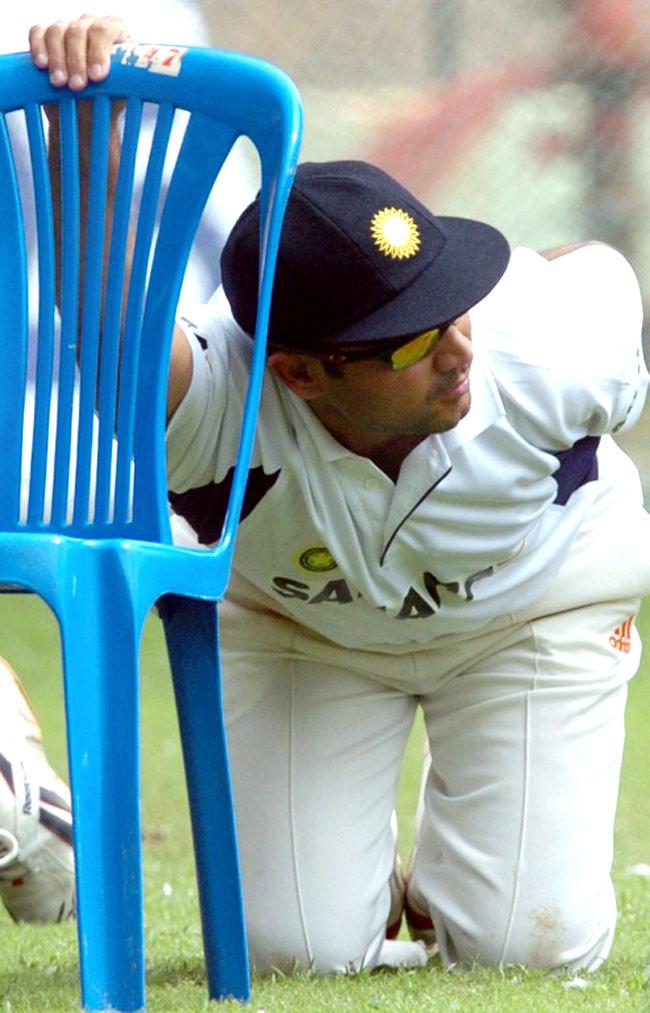 Like his batting, Virender Sehwag was innovative with his practice sessions as well. Here, he does some stretching with a chair at the M. Chinnaswamy stadium on the eve of the first test match between India and Australia, in Bangalore, October 5, 2004.
