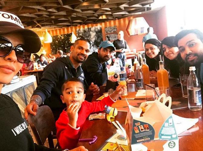 In picture: Shikhar Dhawan with Rohit Sharma, Ajinkya Rahane and their respective wives Aesha, Ritika and Radhika at a lunch outing together en route to London.
