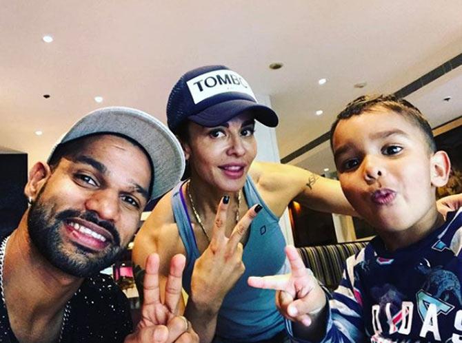 Shikhar Dhawan posted this picture with his wife Aesha and son Zoravar and wrote: 'Feels complete with my family, Missing my daughters though!!! Enjoying breakfast with them, love feeding my son.'