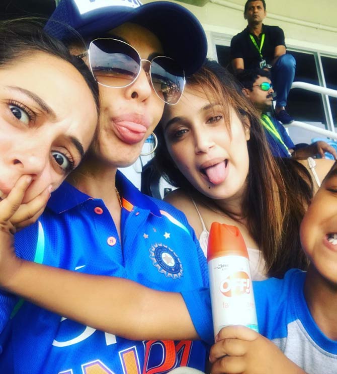 Aesha Dhawan (c) is part of the Indian cricket WAGs club. Seen here with Yuvraj Singh's wife Hazel Keech (L) and Zaheer Khan's wife Sagarika Ghatge (r) during a match.