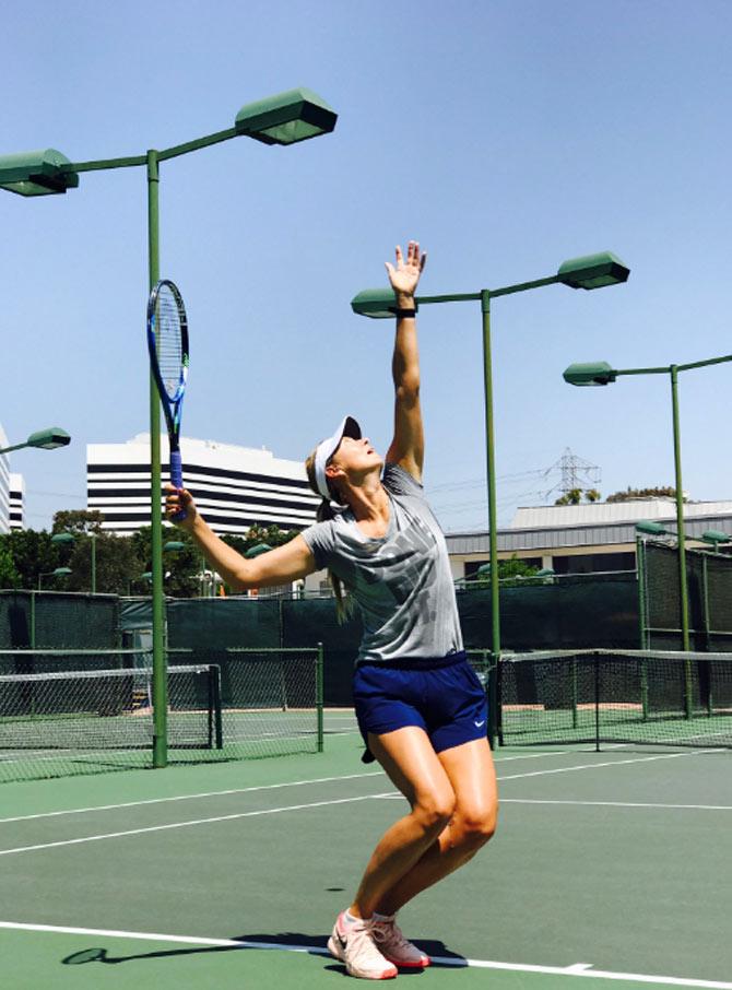 Maria Sharapova posted this photo on twitter with a tennis and sunshine icons