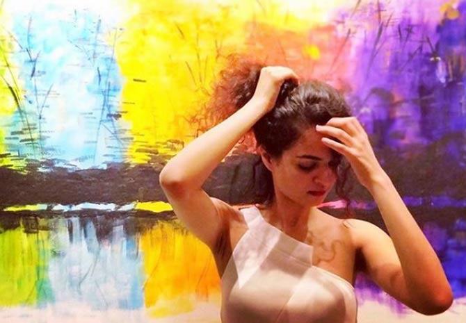 Tania Sachdev with yet another one of her fun captions and photos: Casually getting ready to crawl out of the painting. What? at least it's not a TV