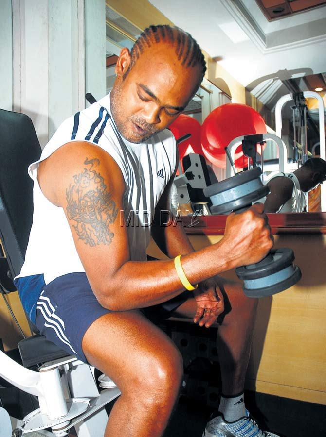 In picture: Vinod Kambli pumping iron at the gym