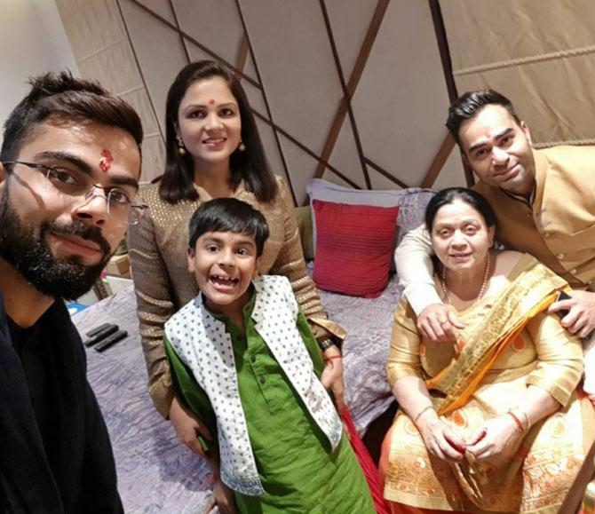 In picture: Virat Kohli with his sister Bhavna, nephew, mother Saroj and brother Vikash during Diwali celebrations at home