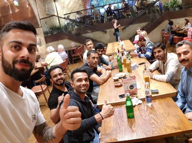 In picture: Virat Kohli with MS Dhoni, Ajinkya Rahane, Kedar Jadhav, Bhuvneshwar Kumar, Umesh Yadav and Sanjay Bangar during a dinner outing