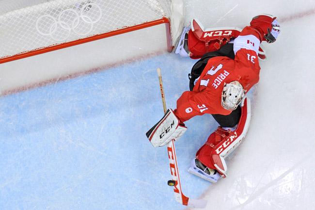Canada's goalkeeper Carey Price deflects the puck during the Men's ice hockey final Sweden vs Canada (AFP)