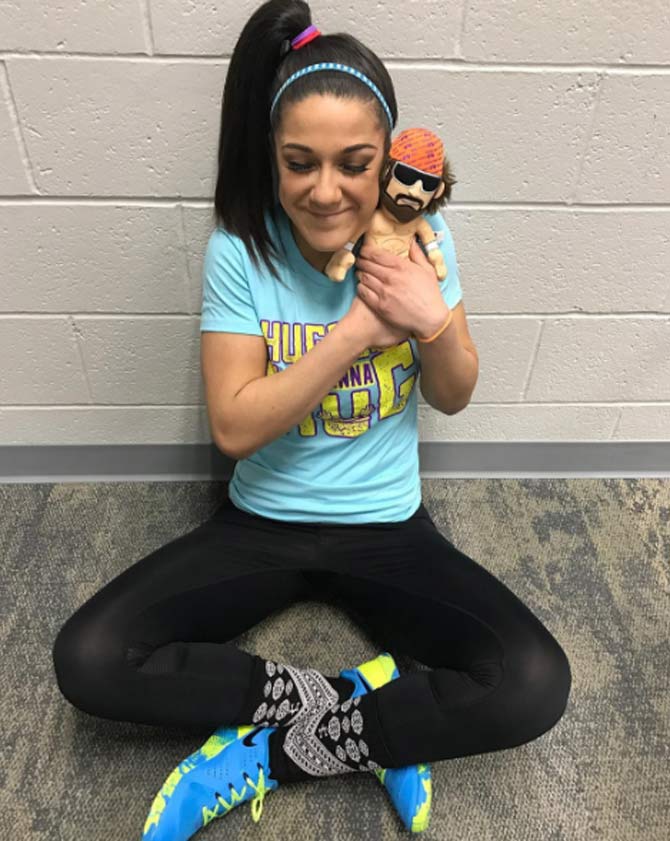 Bayley is the current SmackDown women's champion in her second reign. In picture: Bayley hugs a figurine of her idol - Macho Man Randy Savage