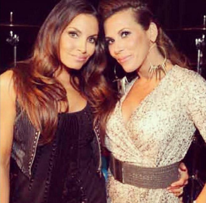 In picture: Mickie James with her good friend and former WWE women's champion Trish Stratus.