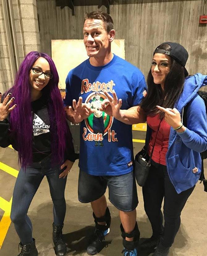 In picture: Sasha Banks with John Cena and Bayley