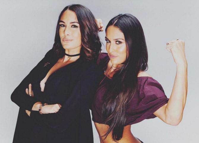 In picture: Brie (L) and Nikki Bella show power in this photoshoot.