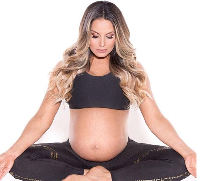 Trish Stratus has been known for teaming up with former wrestlers Test and Albert to form the faction T&A Trish Stratus captioned this photo, 'I just posted the prenatal yoga poses I put into a routine that I did while I was pregnant. Click the link in the bio to see the poses and me in all my bellyiciousness SWIPE LEFT for a pose I did regularly but wasn't til I saw it photogrpahed was like #itlookssoweird I had an amazing birth & a symptom-free pregnancy, I believe due to my yoga, plus that 13 minute, natural delivery - I really attribute it all to my practice and the hundreds (thousands?) of squats I did leading up to the big day. To me, prenatal yoga should be mandatory for all expecting moms. Besides the amazing benefits physically for both pregnancy and to prepare for labor and delivery, creatng a mindful connection to the breath and cultivating a calm presence of mind, body and soul is something that you can take with you into your birthing experience. #mindfulmama #empoweredmotherhood #meditation #prenatalyoga #yoga #yogaforlabor #yogaeverydamnday #flexible #bridgepose #backbends #maternityshoot #motherhood #pregnant #babybump #fitmama  #pregnancy #gentlebirth #naturalbirth #birthwithoutfear'
