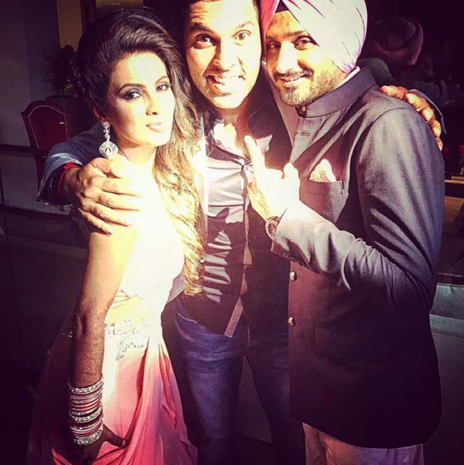 Yuvraj Singh with his Team India buddy Harbhajan Singh and Geeta Basra on their wedding day