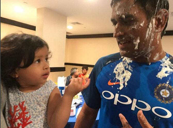 Sakshi Dhoni shared this adorable, candid picture of Ziva and MS Dhoni on the latter's birthday. Did Ziva want a bit off cake from dad MS Dhoni's face?
