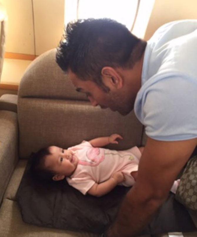 MS Dhoni seems to be entertaining his little one Ziva with a lullaby here.