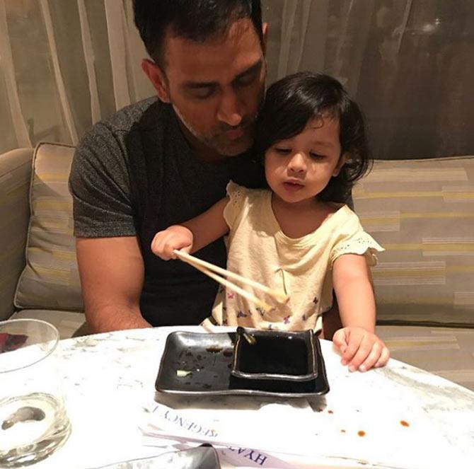 In picture: What is MS Dhoni teaching Ziva here?