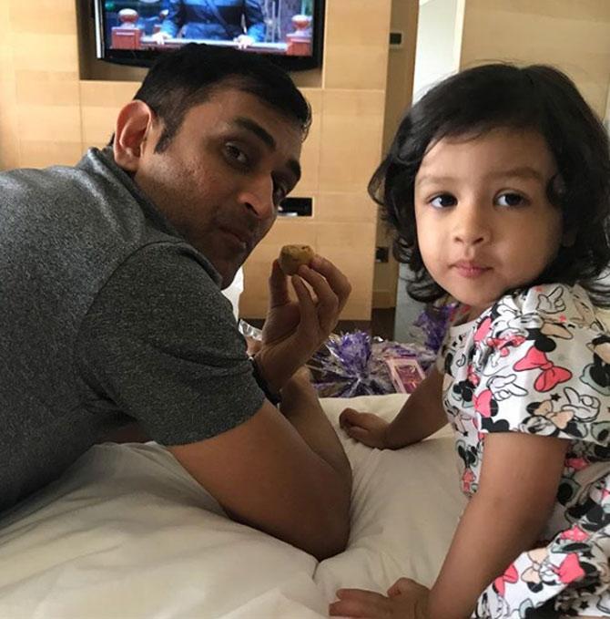 In picture: MS Dhoni relaxing and enjoying a bite with Ziva at home