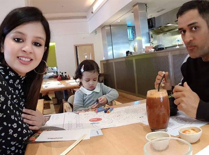 In picture: MS Dhoni, Sakshi and Ziva enjoy some family time on the dinner table at home