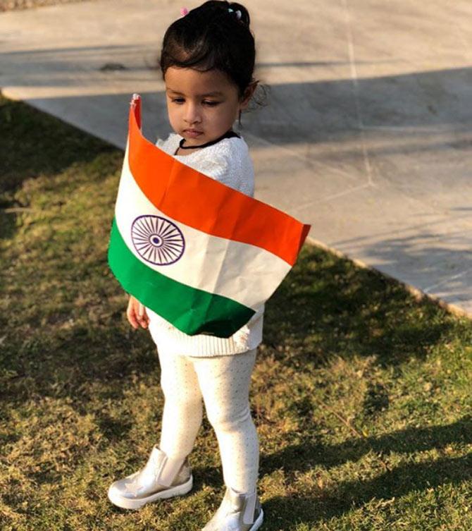 In picture: Ziva Dhoni waves the Indian tricolour